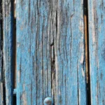Old peeling paint being removed from wood