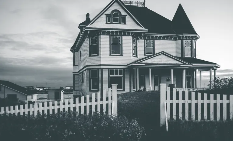 Wooden garden fence around a house