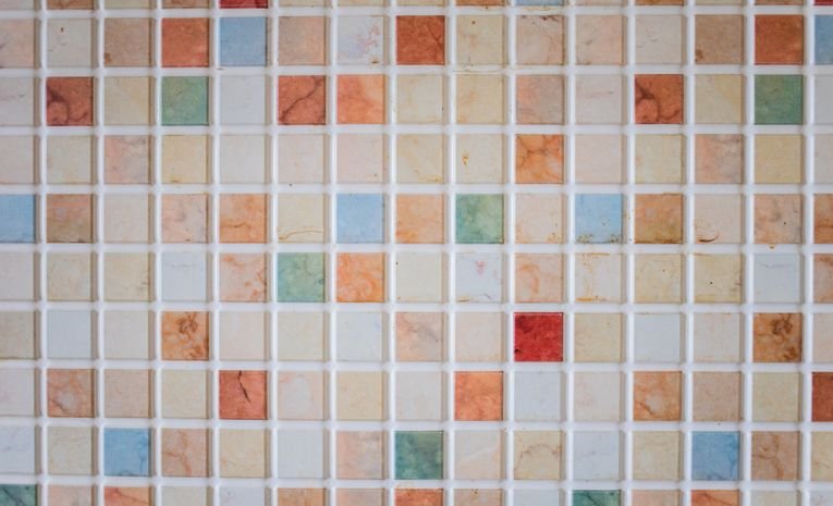Patterned ceramic floor tiles in a hallway