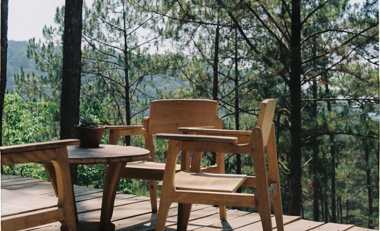 Painted wooden garden furniture in a UK garden