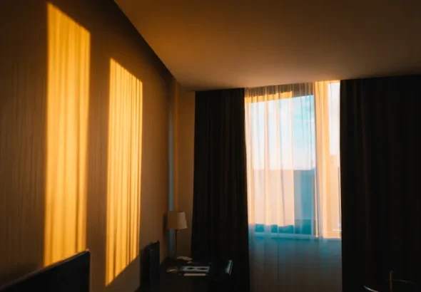 Dark bedroom with blackout curtains blocking light