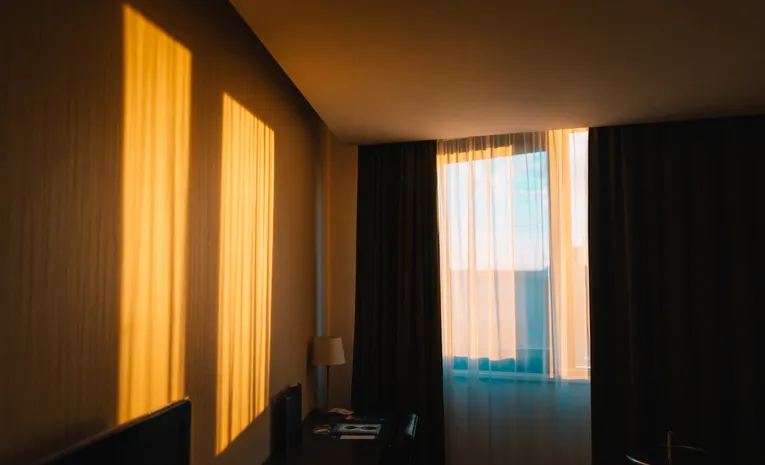 Dark bedroom with blackout curtains blocking light