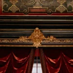 Lined curtains hanging with soft folds by a window