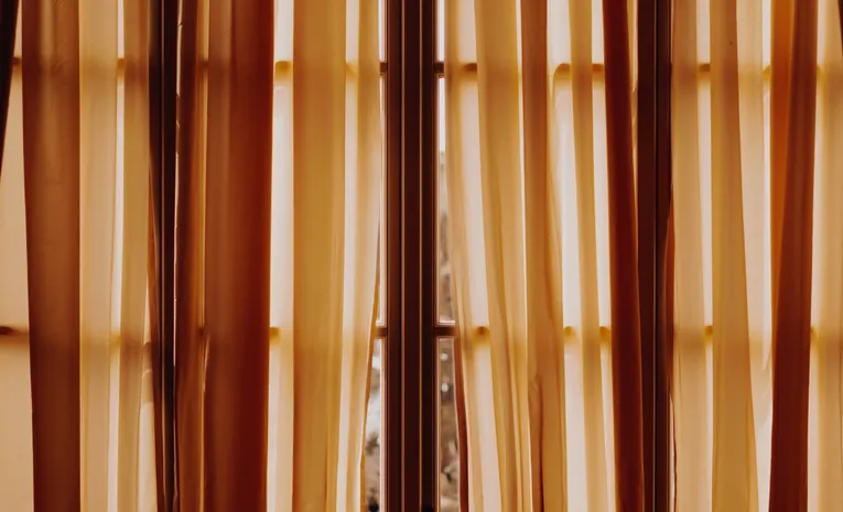 Curtain pole with hanging curtains on a window