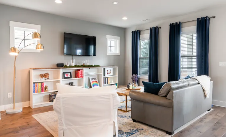 Living room with blue curtains showing modern curtain style