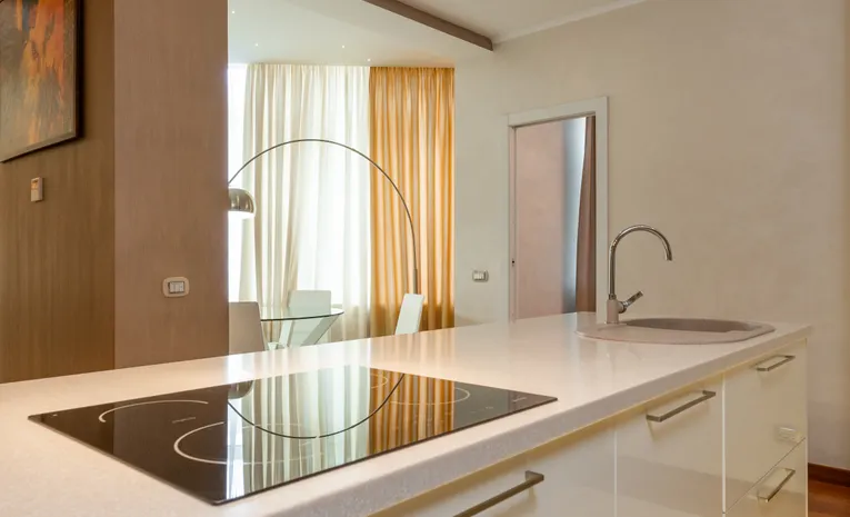 Modern kitchen with wall panelling behind counter